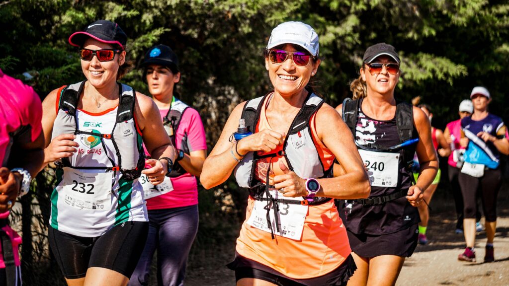 A marathon runner smiles at the camera.